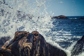 landscape of ocean spray on rocky coast