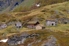 old wooden huts on nature in Norway