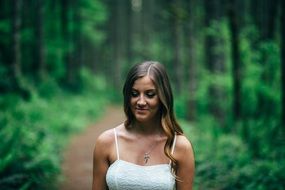 portrait of smiling girl in a forest