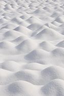 white snow on the mountain in winter