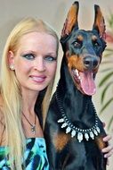 woman with a Doberman pinscher