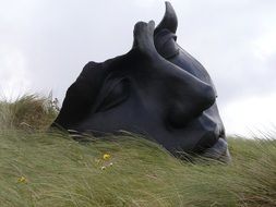 thoughtful face of the statue of a woman on the nature