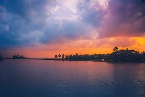 landscape of dark lake on Island at the sunset