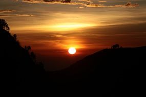 orange ball of the sun in the evening