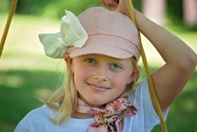 young happy girl face smiling close-up on blurred background