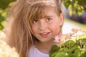 girl with long hair on a background of nature