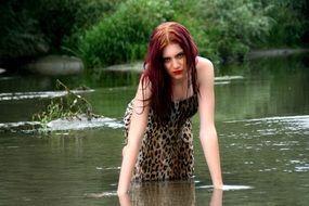 angry girl kneeling in water