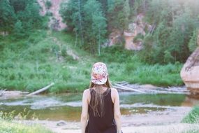 girl with cap in a forest