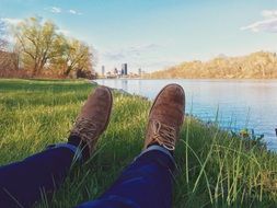 feet in shoes near the water