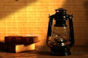 two books and an oil lamp