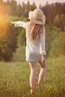 blonde girl in white hat back view