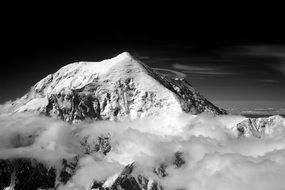 black and white image of a snowy mountain peak