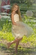 happy smiling blonde girl in nice dress