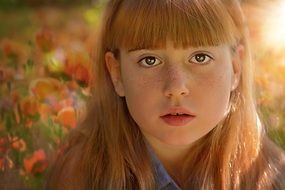 Little girl with long hair close-up