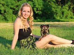 girl with yorkshire terrier on the lawn