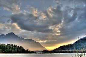 landscape of lake and trees on the background of the mountains at dusk, British Columbia, Canada