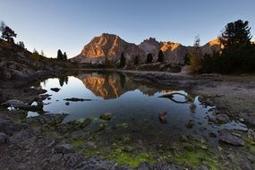 reflection of mountains in a pond