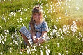 girl sitting on the wild meadow