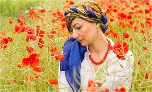 woman in the red poppy field