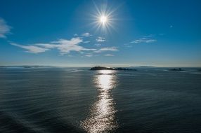 Beautiful shiny sunset above the sea in summer