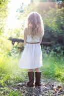 girl in white dress and cowboy boots