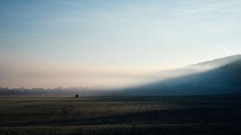 panorama of green valley in the haze