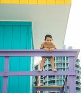 little boy posing on fence