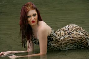 girl posing on a background of the river in the jungle