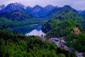 panorama of the castle by the lake among the picturesque mountains