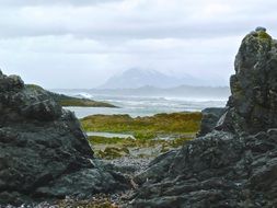 rocky valley under a cloudy sky