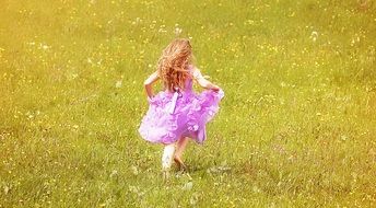 girl in pink on a meadow