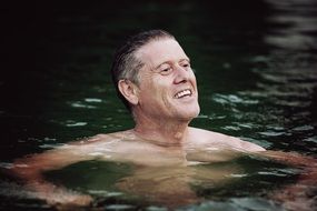 portrait of head of mature man above water