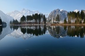 panorama of lake Bergsee on the background of alpine mountains in Austria