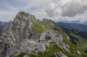 Rocky mountains under white clouds