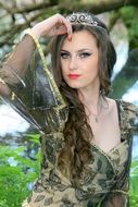 girl in a dress with a tiara on her head