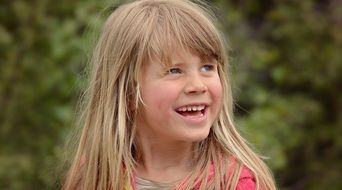 Little girl with long hair with a smile