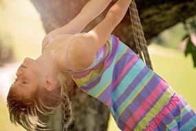 little girl in motion on nature