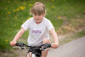 Girl on the bike outdoors