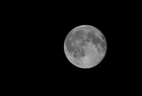 closeup photo of moon on black background