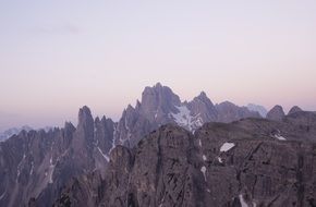 snowy mountain range in the evening