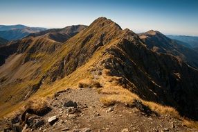 low mountains with peaks on a sunny day