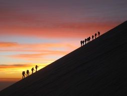 mountain tourists at sunrise