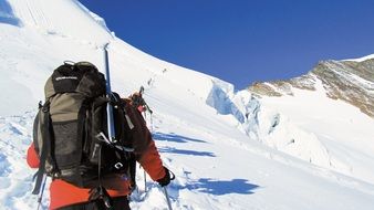 ascent climbers on a snowy mountain