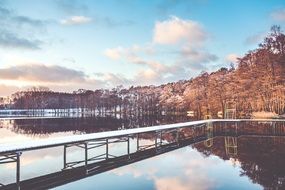 lake pier covered by snow