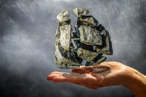 rock stones explosion in hand