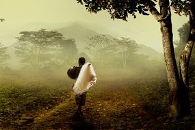 fisherman on a trail among nature