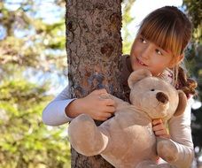 Child with teddy bear in a hands