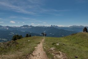 Mountain path in the background of a picturesque landscape