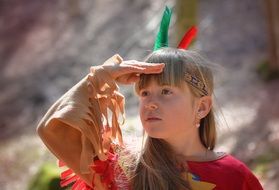 Little blonde girl dressed as an Indian