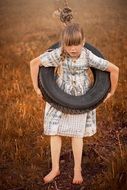 girl in tire swing